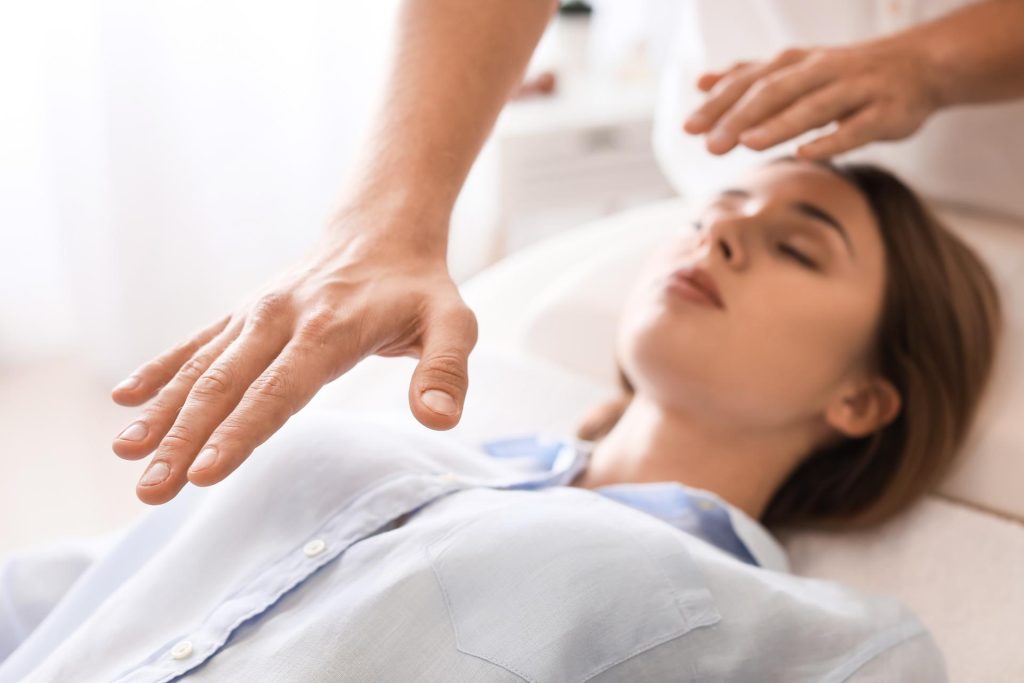 Therapist performing mind-body therapy session for patient